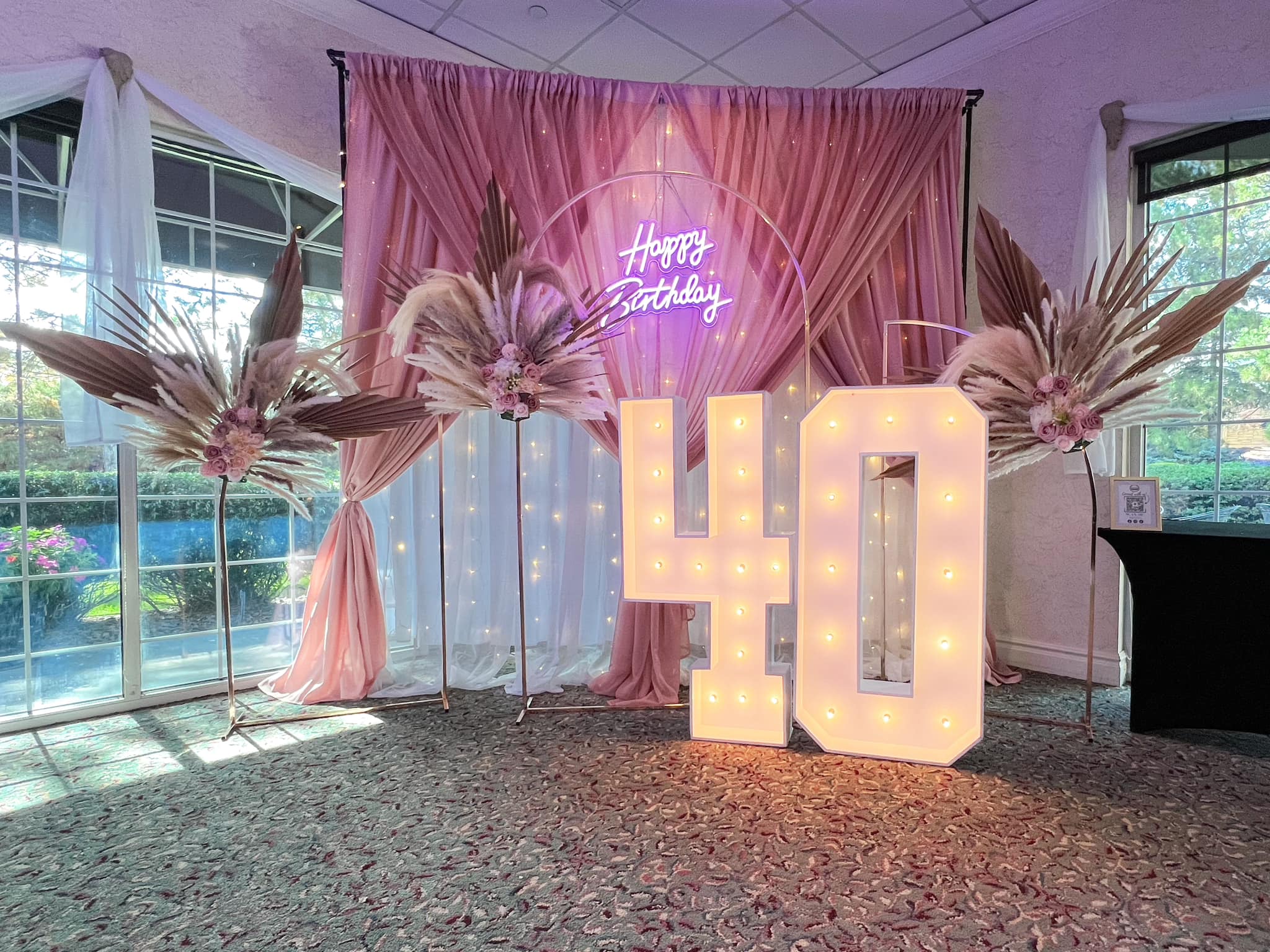 Elegant draping done for a special celebration in denver. Draping services offered in Denver and surrounding areas, marquee lights and floral arrangements.