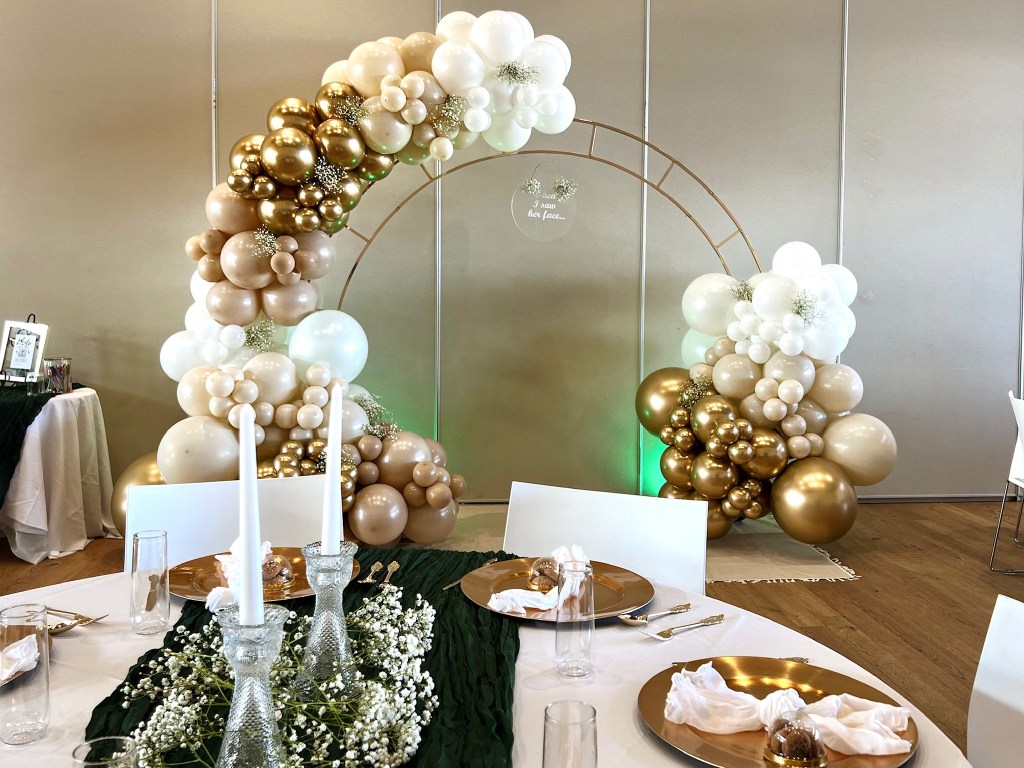 Elegant wedding balloon garland installation in the denver metro area. Chuchi's Events offer balloon installation services and backdrop rentals. Balloon Delivery