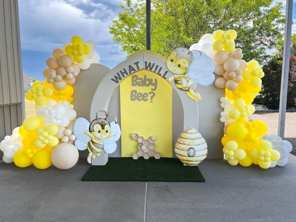 Custom backdrop rental in Denver and surrounding areas, complete with balloon garland decor and installation. What will baby bee, gender reveal