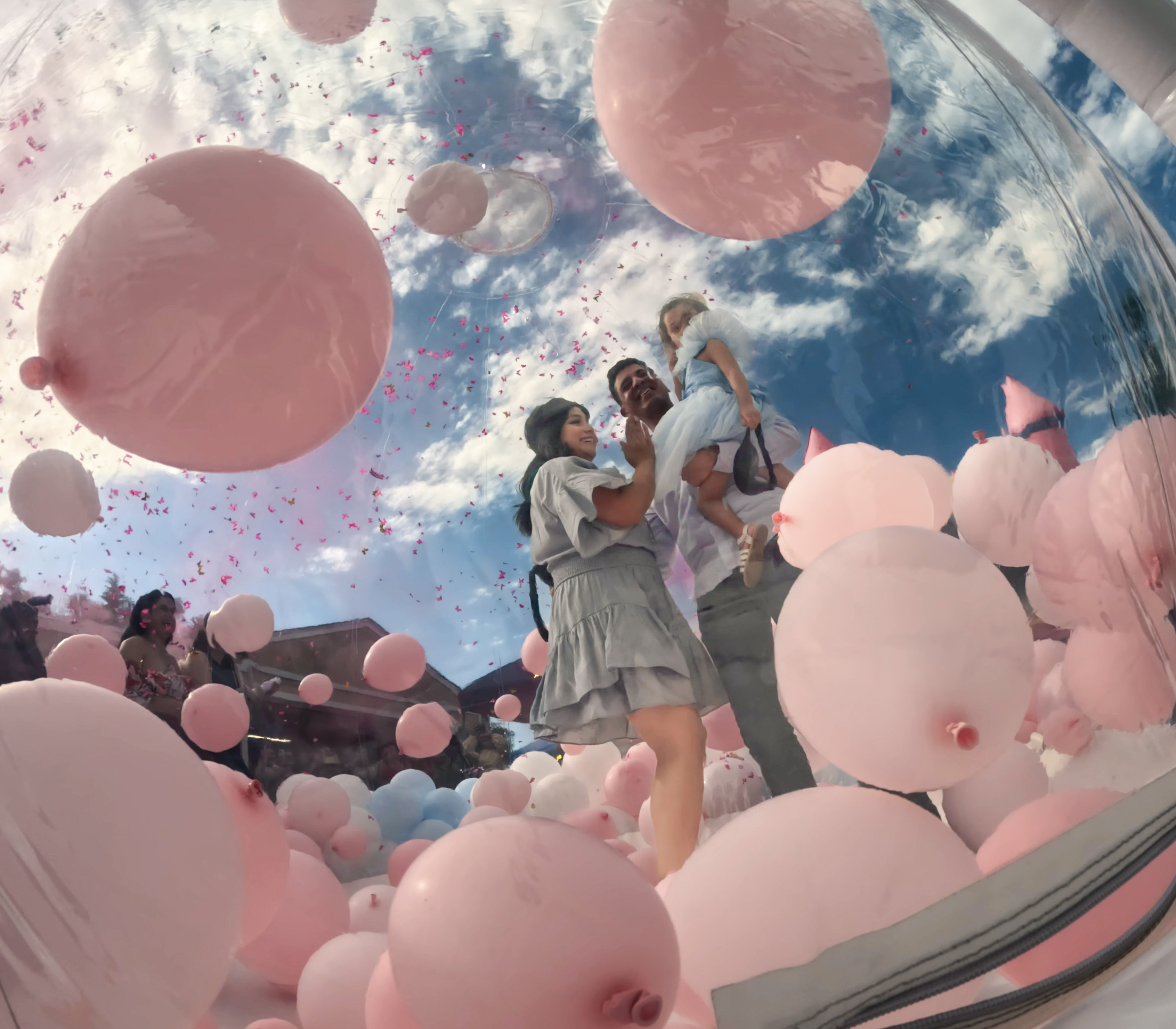 Chuchi's Events gender reveal setup featuring our exclusive bubble house, beautifully decorated with blue and pink balloons for the big reveal. Perfect for outdoor celebrations in Denver, this bubble house creates a stylish and fun atmosphere for both kids and adults. The clear design allows for a unique gender reveal experience while offering a stunning party centerpiece.