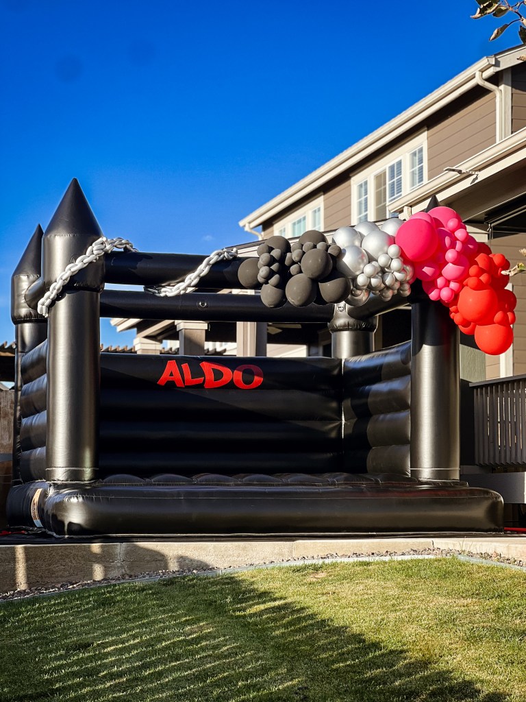 Chuchi's Events sleek black bounce house rental in Denver, perfect for upscale parties and events. Modern, stylish, and a hit for any celebration in the Denver metro area.