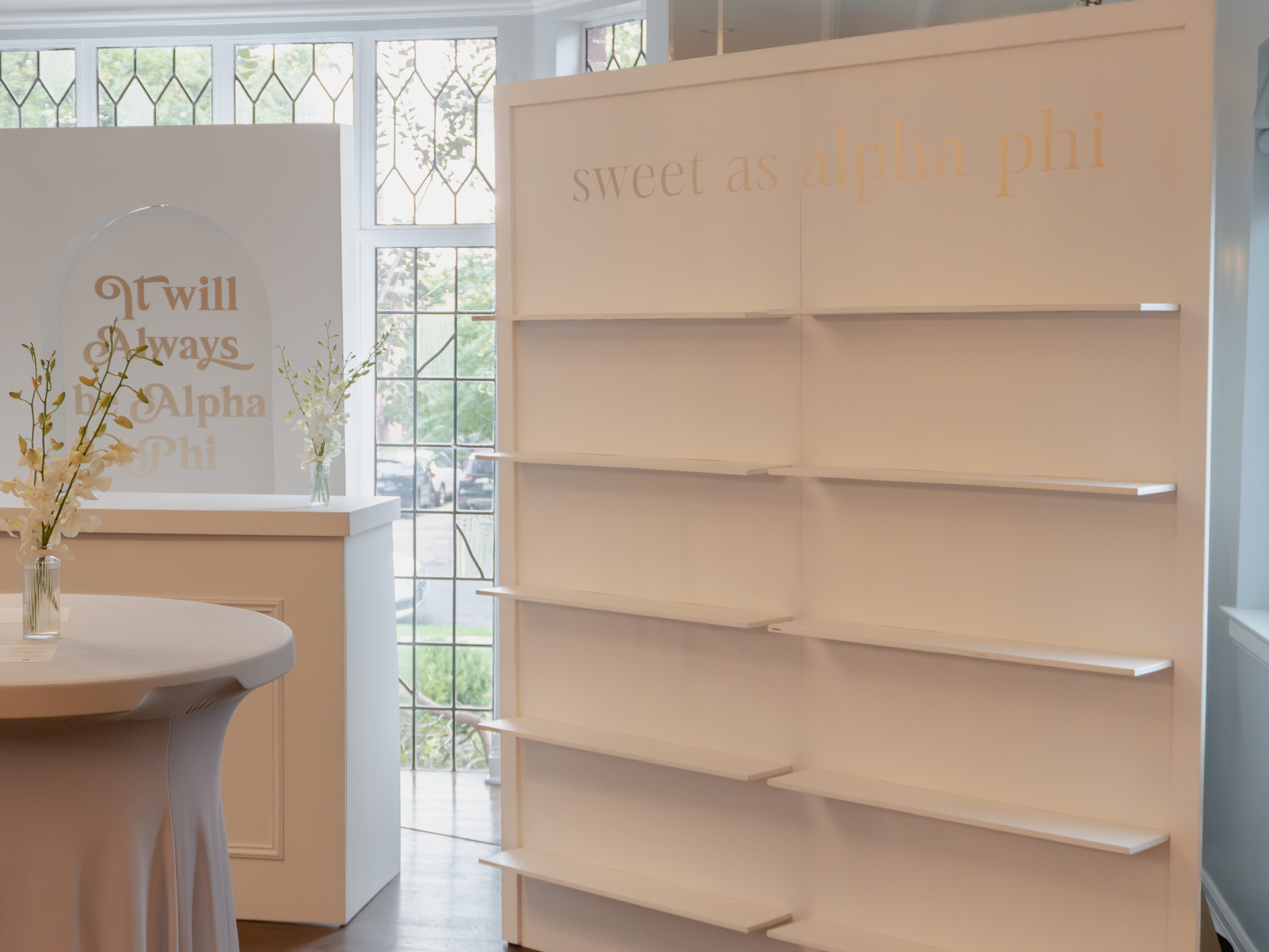 Elegant open arch shelf backdrop with matching event bar and 3D box cover arch, ideal for Denver weddings, branding activations, and milestone celebrations.