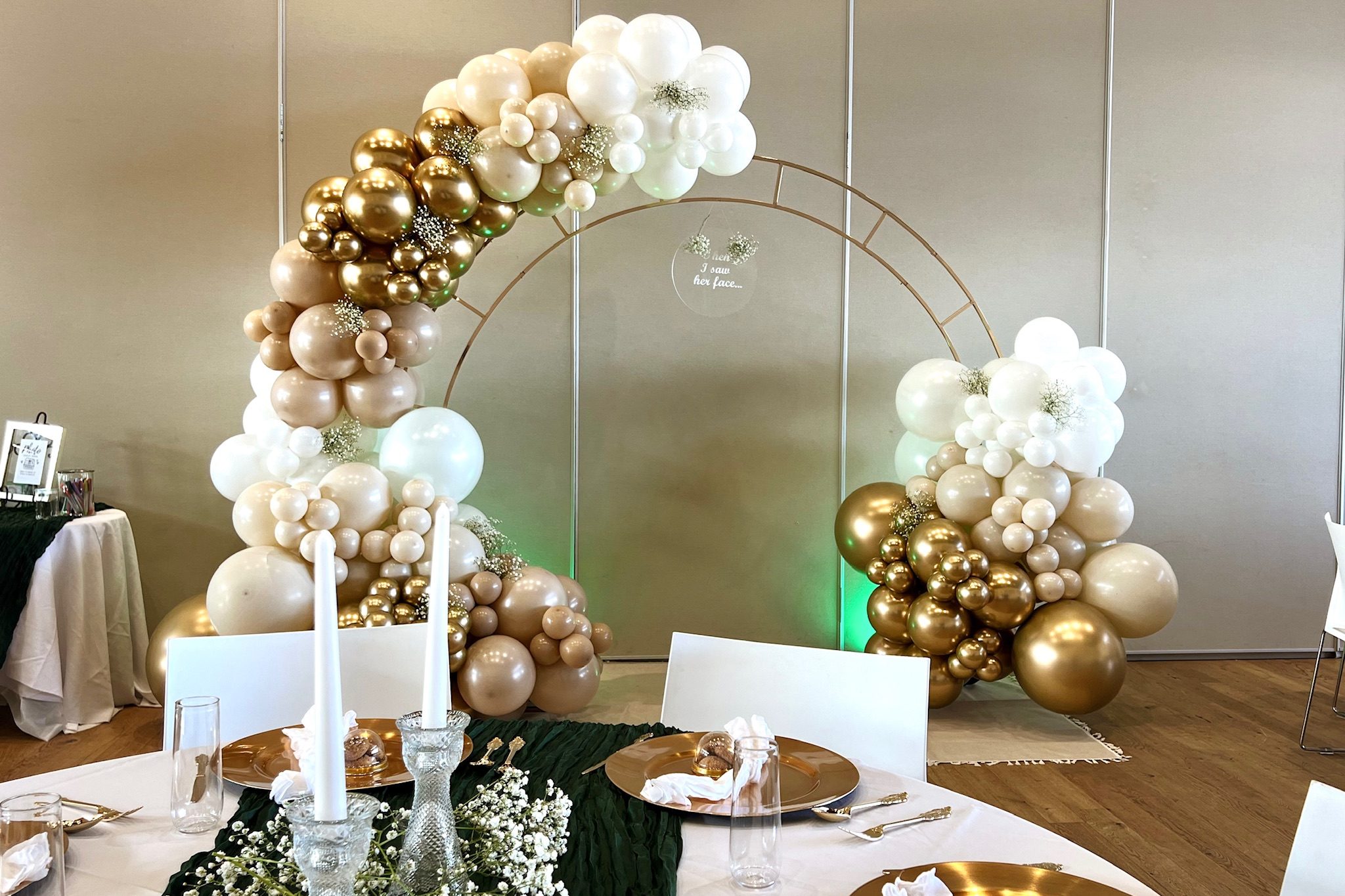 Elegant wedding balloon arch and backdrop installation in Denver, with neutral and metallic balloons perfect for engagement parties and ceremonies.